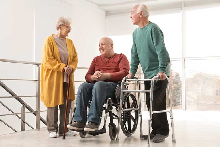 Group of happy senior people in hospital