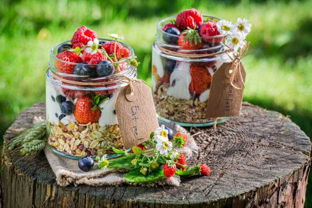 Granola with berry fruits and yogurt in summer garden 4 Best Antioxidant Foods That Will Benefit Your Health