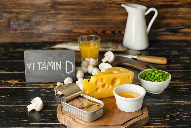Different healthy products with vitamin D on wooden background Different healthy products with vitamin D on wooden background