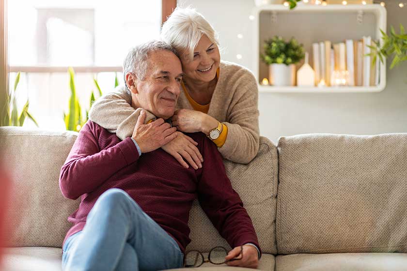 Portrait of a happy senior couple relaxing together at home