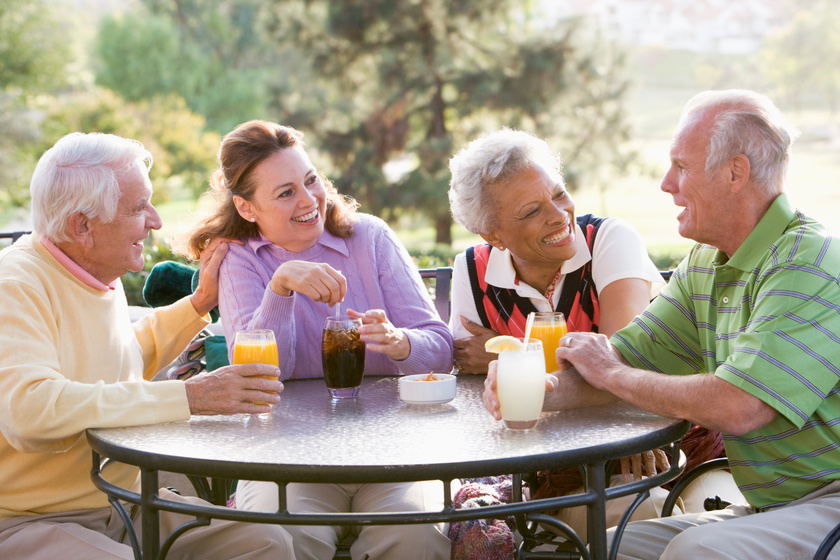 Friends Enjoying A Beverage By A Golf Course