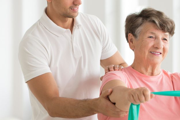 Senior stretching with elastic tape Exercises For Seniors With Scoliosis
