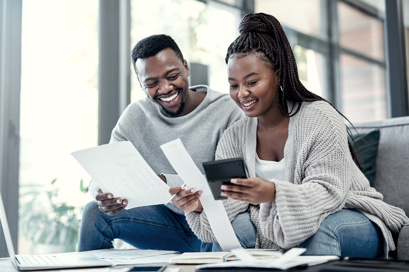 We saved so much more this month. a young couple going through paperwork at home. How To Talk To Siblings About Your Aging Parents Moving Plan To Fairplay, MD Assisted Living