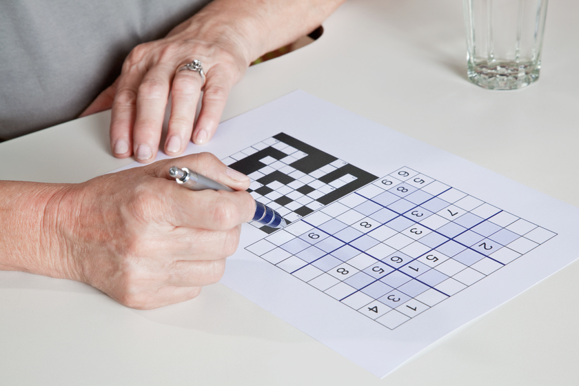 Mature Woman playing Sudoku Puzzle Benefits Of Assisted Living Care In Fiddlesburg, MD For Cognitive Health Improvement