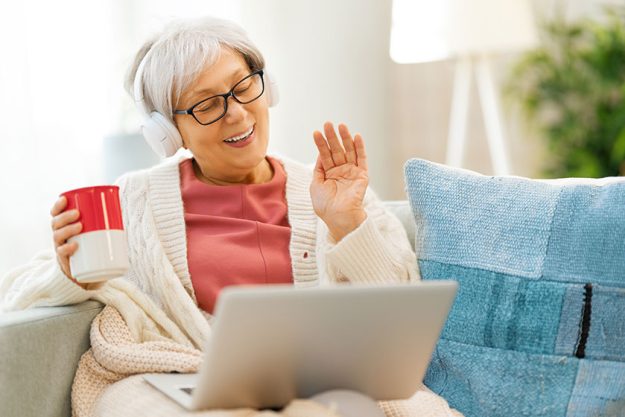 Joyful beautiful senior woman is using laptop Joyful beautiful senior woman is using laptop