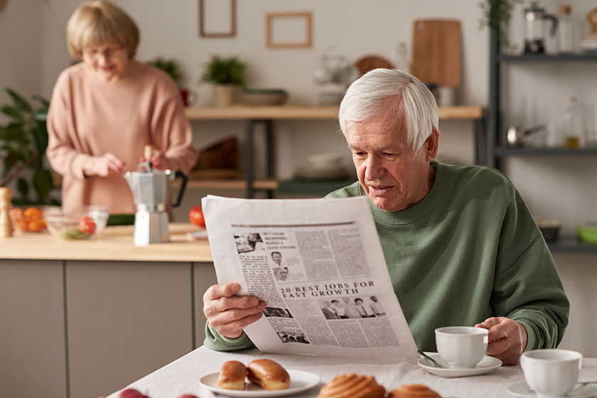 Reading newspaper in the morning