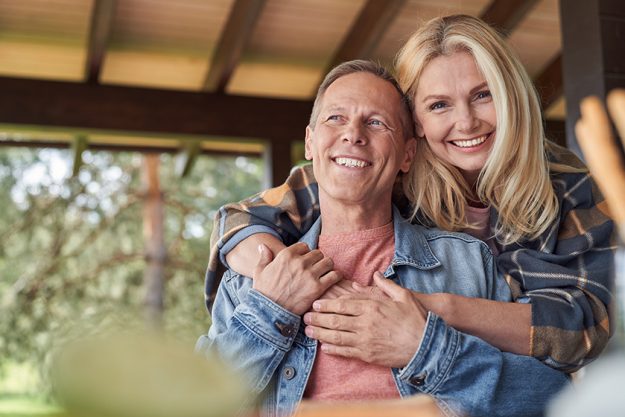 Smiling loving elderly couple spending time