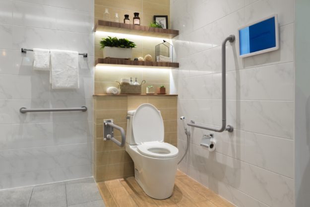 Interior of bathroom for the disabled or elderly people. Handrai Interior of bathroom for the disabled or elderly people. Handrai