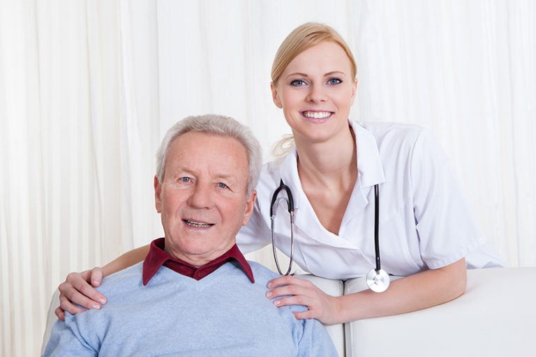 Portrait Of Happy Doctor And Patient