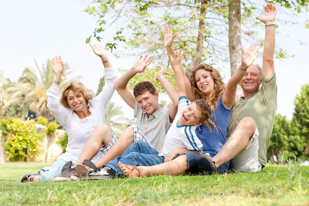 Potrait of family waving hands