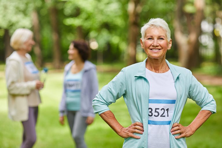 Waist up portrait shot of joyful senior