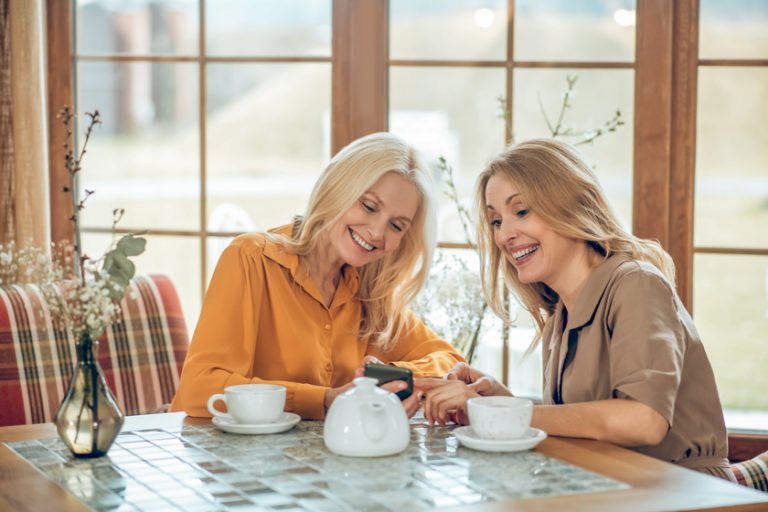 Two pretty woman spending time together and enjoying