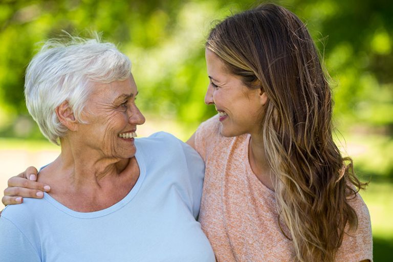 Family standing and smiling