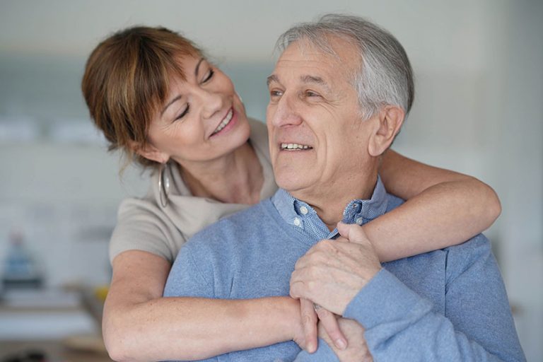 Portrait happy senior couple home