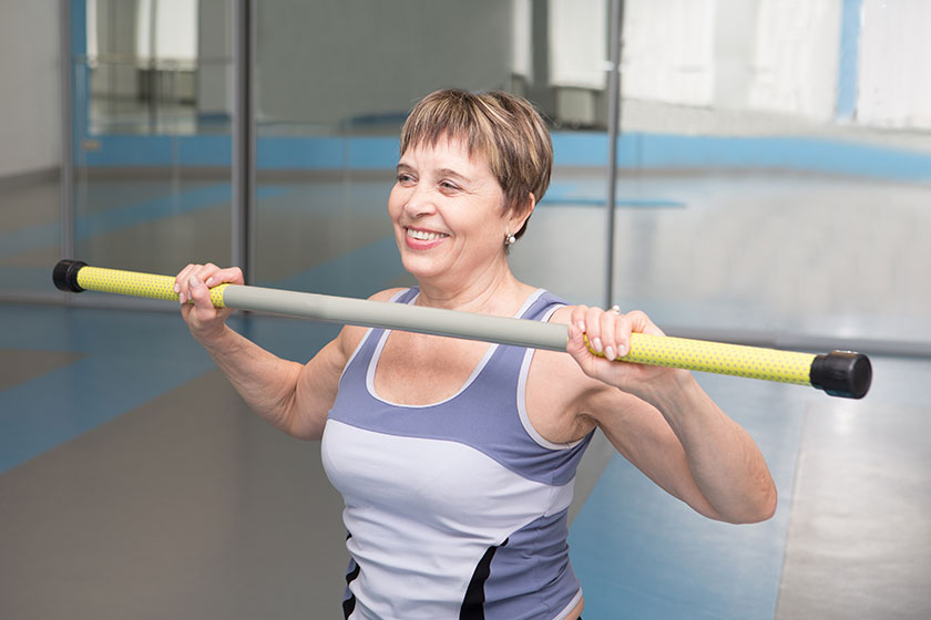 Portrait of pretty senior woman exercising in gym Portrait of pretty senior woman exercising in gym