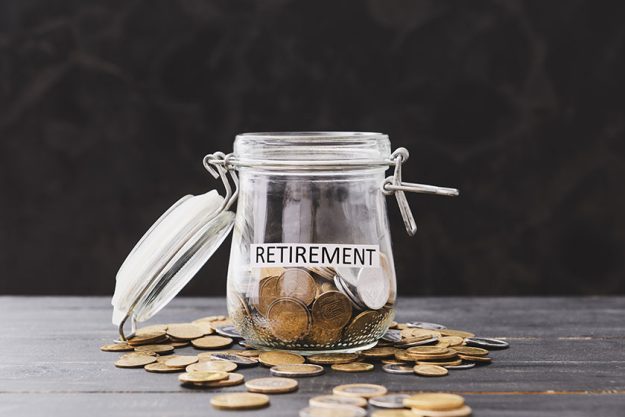 Jar coins word retirement dark background