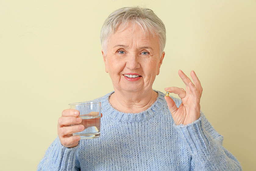 Senior woman fish oil color background