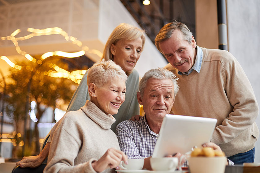 Group of positive senior friends in casual clothing
