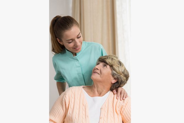Professional carer nursing senior lady Professional carer nursing senior lady