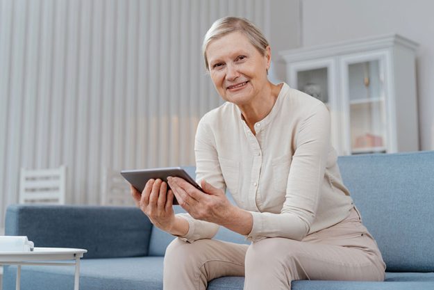Sick woman consulting a doctor by video link.