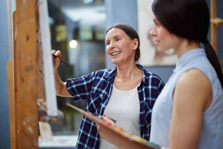 Teacher and student painting