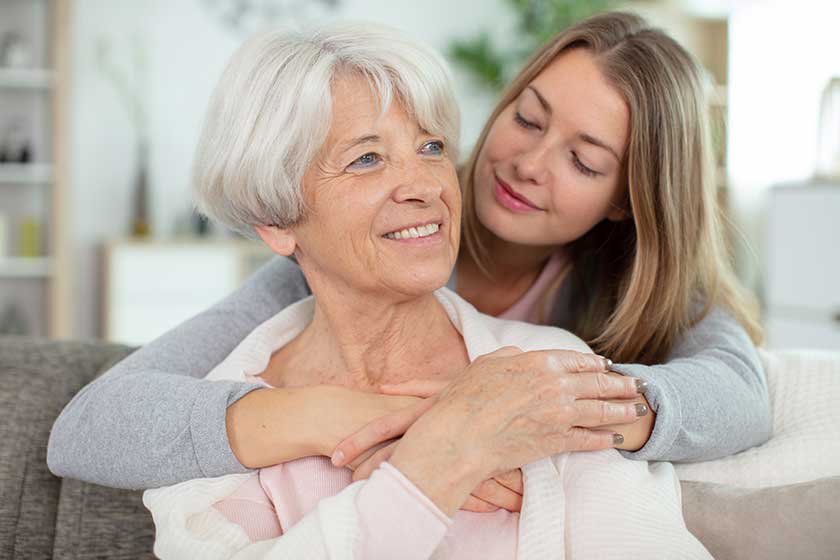 Daughter embracing her mother with love