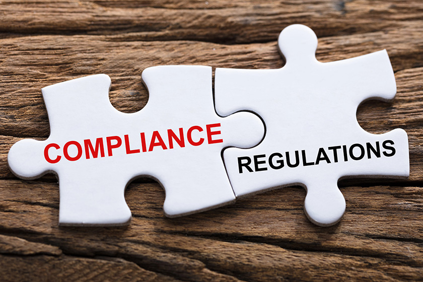 An Elevated View Of Compliance And Regulations Word Written On Pieces Of Jigsaw Puzzle An Elevated View Of Compliance And Regulations Word Written On Pieces Of Jigsaw Puzzle