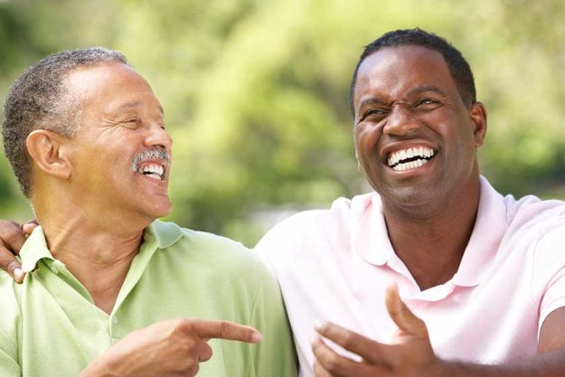 Father With Adult Son In Park