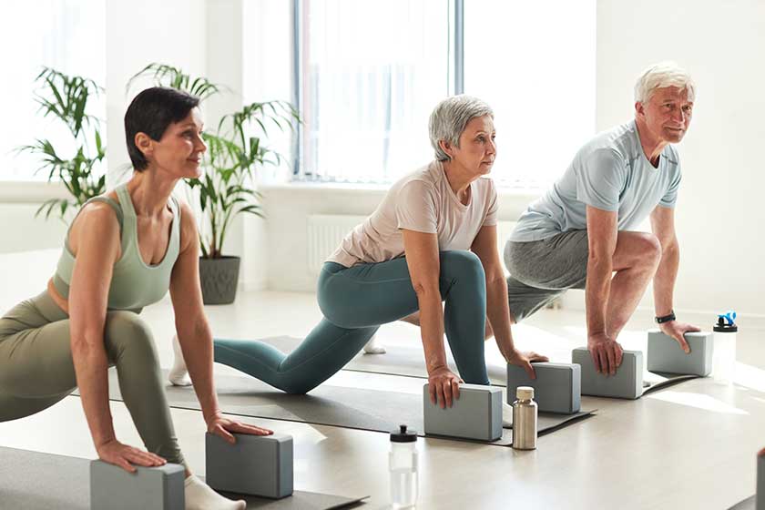 Group of people exercising during sport training in gym