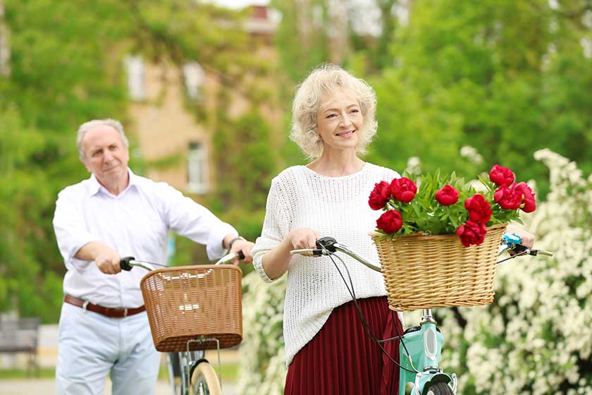 Happy senior couple with bicycles