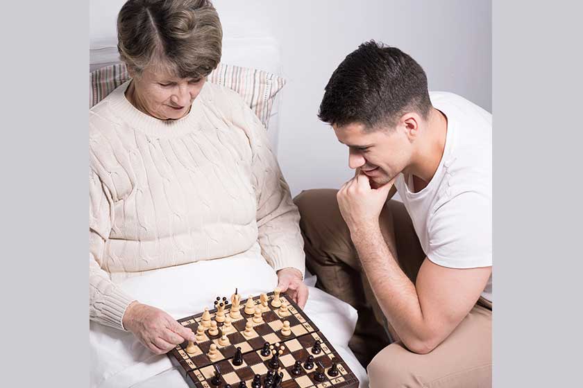 Man playing with grandmother Man playing with grandmother