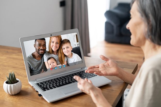 Senior woman talking on the laptop online