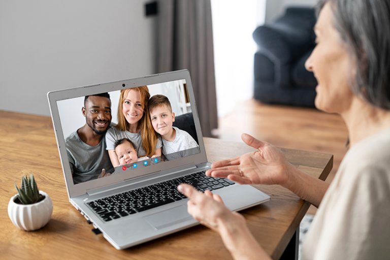 Senior woman talking on the laptop online