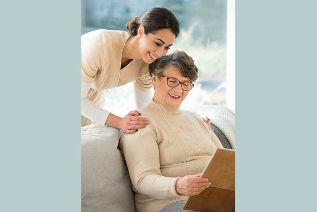 Grandmother looking at photo album