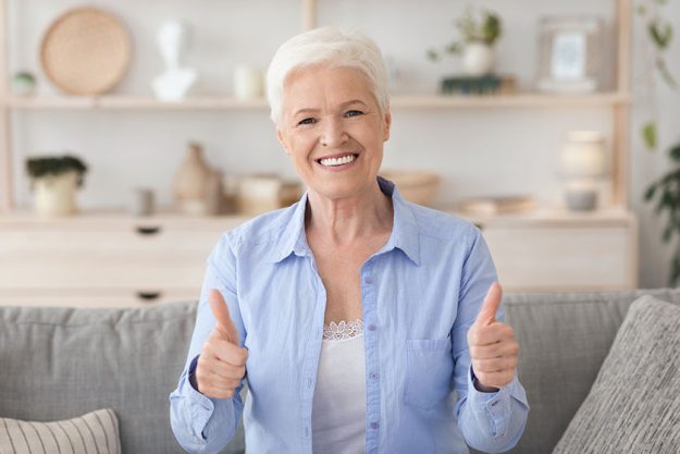 Life Insurance For Retirement. Happy Senior Lady Showing Thumb Up At Camera