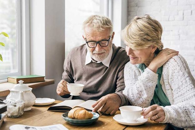 Senior couple having morning breakfast