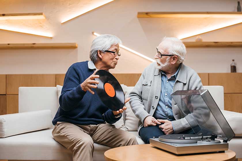Senior friends with vinyl record