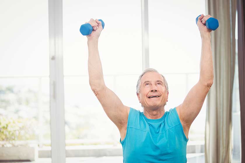 Senior man holding dumbbells Senior man holding dumbbells