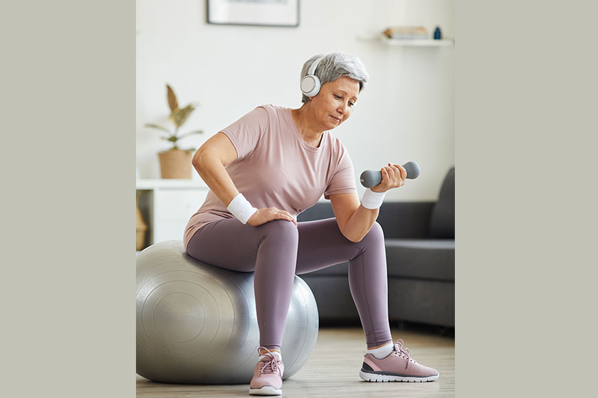 Senior woman exercising with dumbbells Senior woman exercising with dumbbells