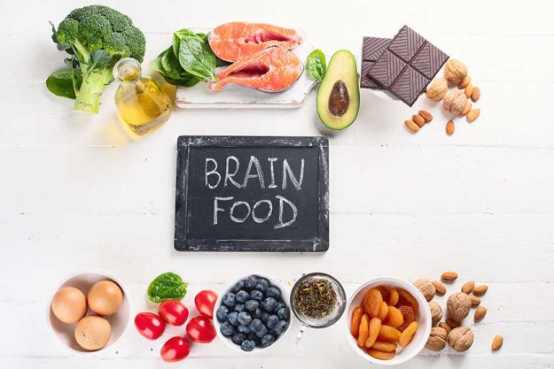 Top view of arrangement of food for brain and memory, healthy eating concept Top view of arrangement of food for brain and memory, healthy eating concept