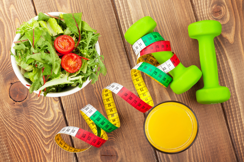 Dumbbells with measuring tape — Photo