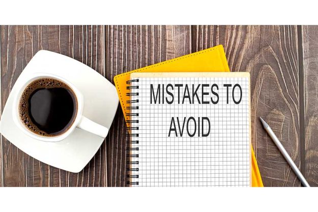 MISTAKES-TO-AVOID-text-on-the-notebook-with-coffee