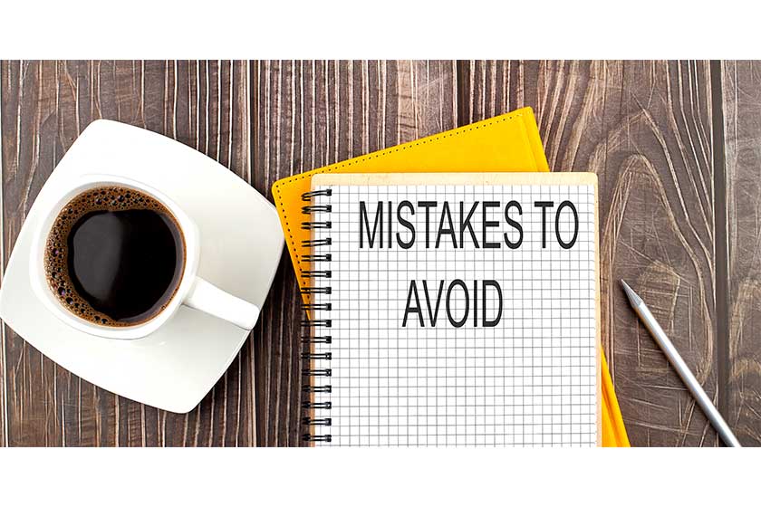 MISTAKES-TO-AVOID-text-on-the-notebook-with-coffee