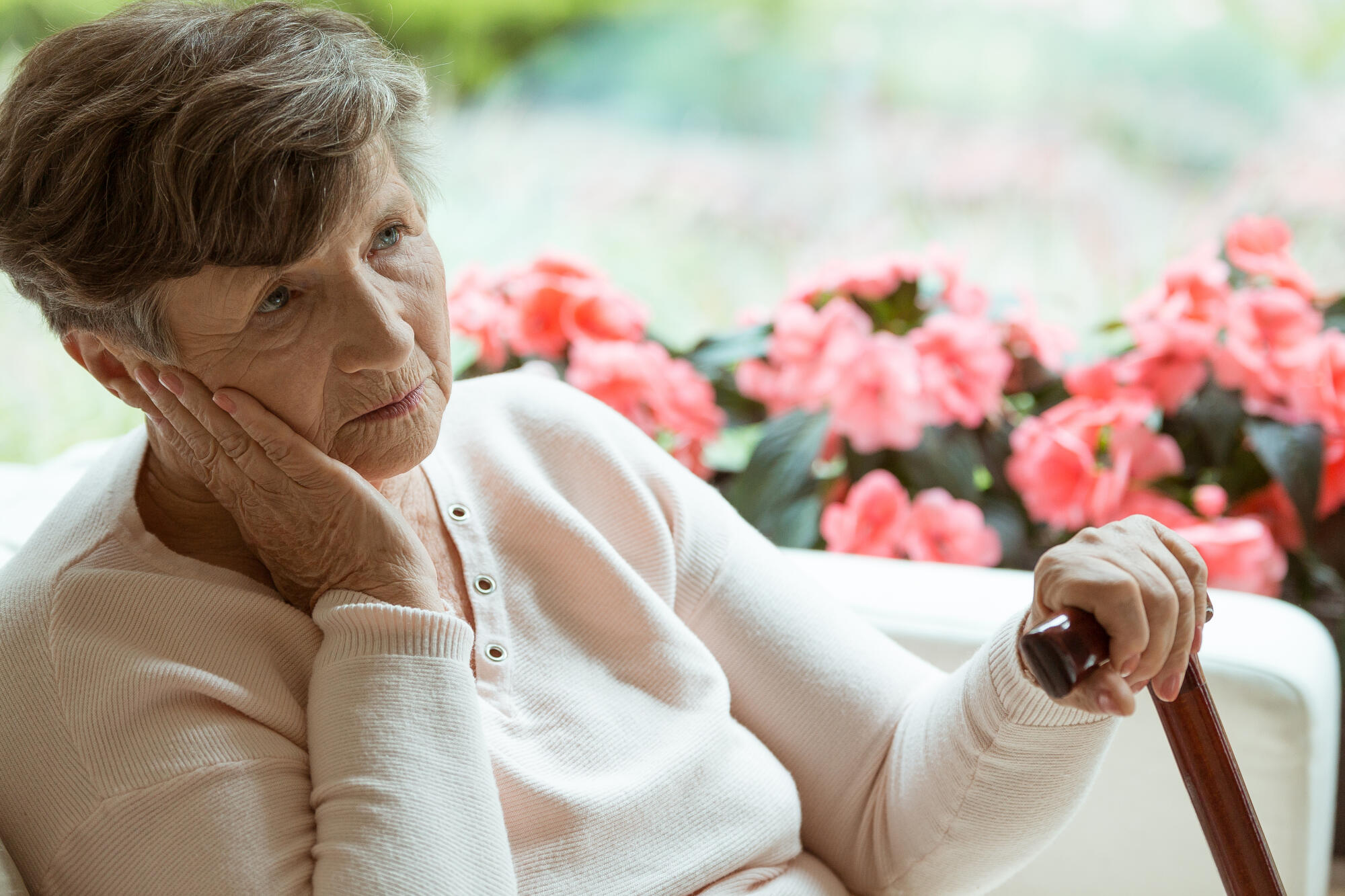 Sad,Old,Lady,With,Cane,Sitting,Alone,At,Nursing,Home