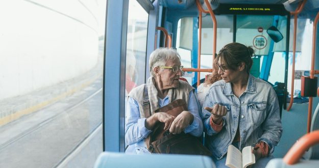 Senior,Man,And,Mature,Woman,Talking,Together,While,Traveling,With