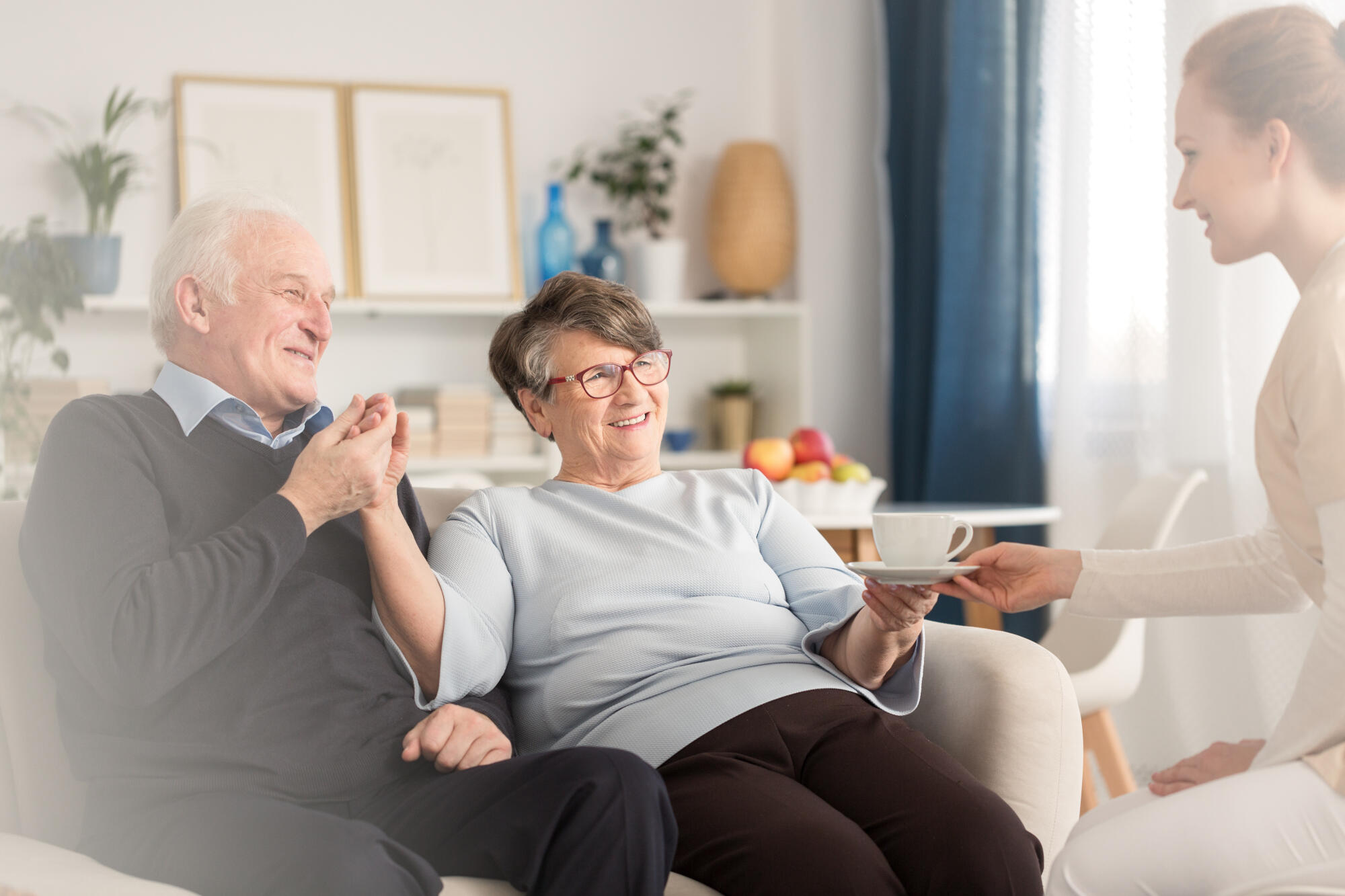 Young,At,Heart,Emotional,Senior,Couple,Holding,Hands,While,Sitting