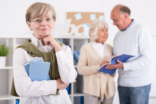 Portrait,Of,Content,Senior,Woman,Studying,At,University