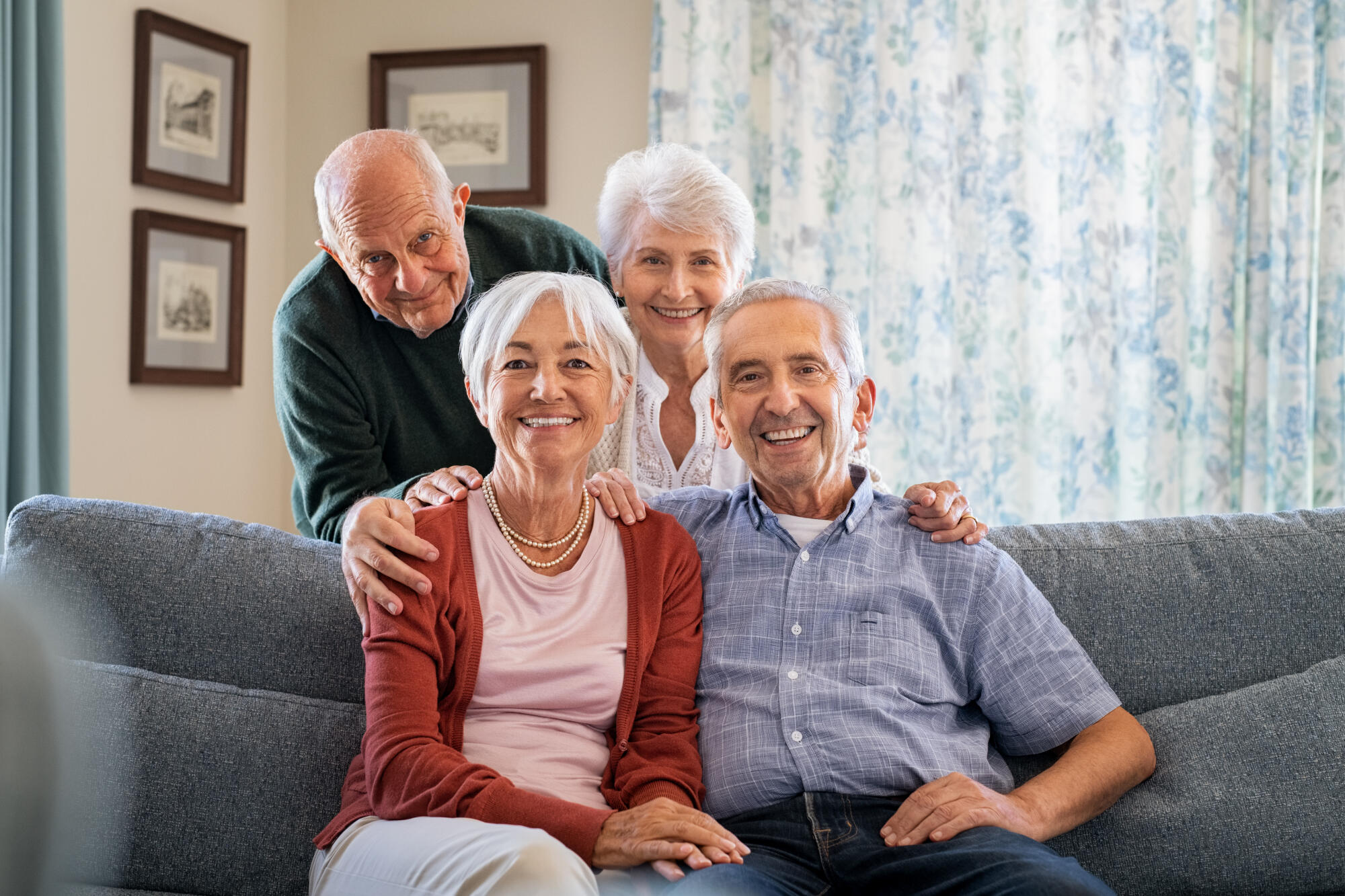 Portrait,Of,Happy,Elderly,People,On,Couch,At,Care,Centre