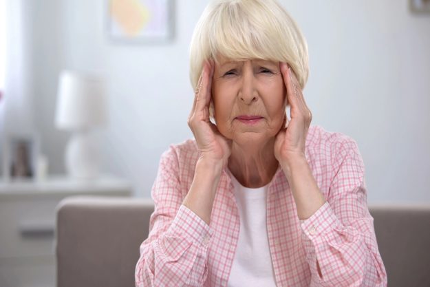 Senior woman massaging temples, feeling migraine pain, health problems — Photo Senior woman massaging temples, feeling migraine pain, health problems — Photo