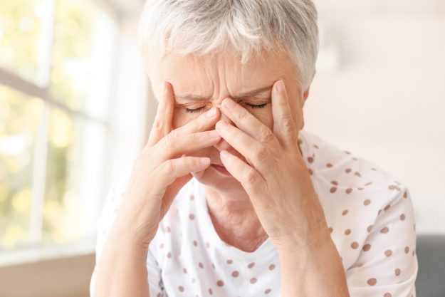 Stressed senior woman suffering from headache Stressed senior woman suffering from headache — Photo